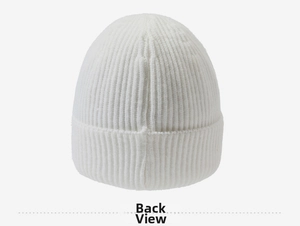 Detail view of the white ribbed knit beanie back side showing fine vertical weave texture