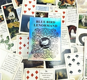 Detailed holographic Blue Bird Lenormand oracle card box set with various divination cards
