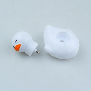 Detail of creative white duck shaped ballpoint pen with split design and metal nib