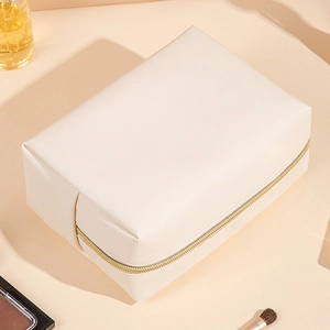 Waterproof octagonal PU leather makeup bag in cream white with elegant gold zipper