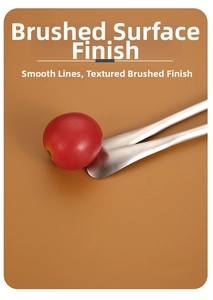 Close-up of brushed 304 stainless steel fork texture holding a fresh cherry tomato