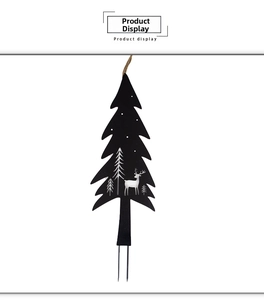 Detail of black metal Christmas tree stake with reindeer silhouettes and garden ground plug