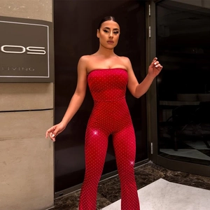 Elegant red tube top jumpsuit with shimmering rhinestones and flared leg for party wear