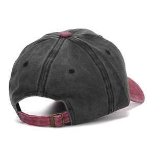 Detailed view of washed cotton baseball cap with adjustable metal buckle and contrast colors
