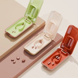Tragbarer Tablettenteiler zum Zerschneiden von Pillen in Grün, Beige und Orange