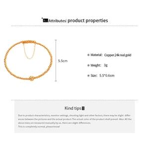 Macro detail of 24K gold plated geometric bead bracelet with textured spiral design