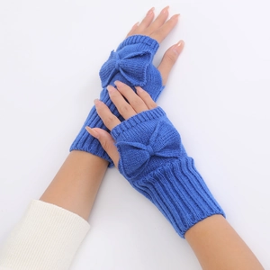 Detail of blue knitted fingerless gloves with a large bow and ribbed cuff design