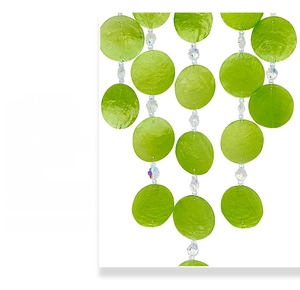 Detail of green shell wind chime with natural textures and transparent faceted beads
