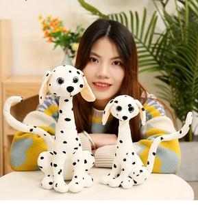 Detail of soft plush dalmatian stuffed animals in small and large sizes with black spots