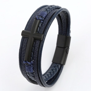 Detail of multi-layer blue leather bracelet featuring a matte black cross and magnetic clasp