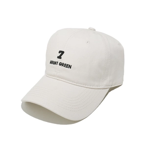 Detail of Mount Green 7 embroidery on a cream cotton baseball cap with stitched brim