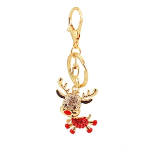 Sparkling crystal reindeer keychain with gold finish and red rhinestone details on white background