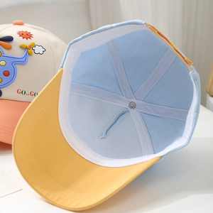 Detail of kids baseball cap featuring breathable mesh lining and cartoon airplane patch