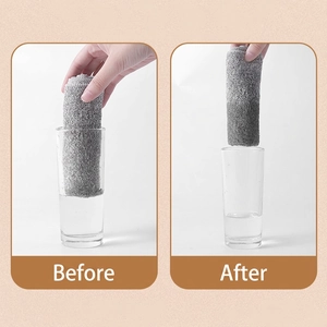 Absorbent bamboo charcoal fiber cleaning cloth showing before and after water absorption