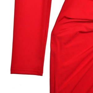 Detail shot of the red ruched fabric and high-quality stitching on this long sleeve dress