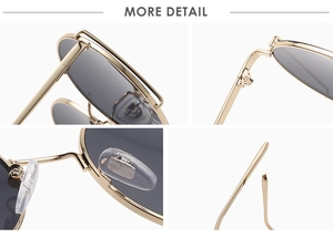 Detail view of round metal sunglasses featuring a double bridge and soft nose pads