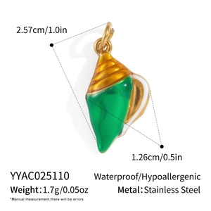 Detail view of 18K gold plated stainless steel conch shell pendant with green enamel inlay