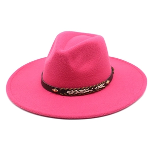 Detail of rose pink fedora hat with black leather band and metal stud embellishments