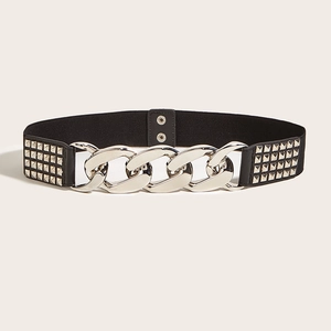 Detail of wide elastic waist belt with silver chunky chain and square metal rivets