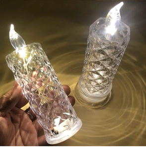 Close-up of diamond-cut crystal LED candle with warm glow for romantic atmosphere