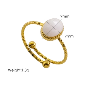 Detail of 14K gold plated hammered ring featuring an oval gemstone and size dimensions