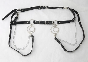 Close-up of Harajuku punk leather body chain with silver metal rings and hanging chains