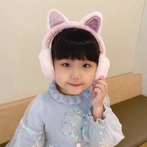 Close-up of pink plush earmuffs for kids with purple sequins and soft faux fur texture