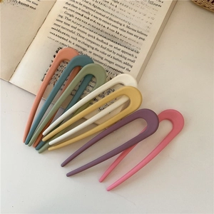 Set of seven candy-colored U-shaped matte hair pins in assorted pastel shades