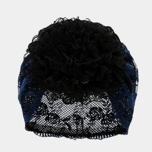 Detail of multi-layer lace flower cluster and breathable openwork mesh on beanie