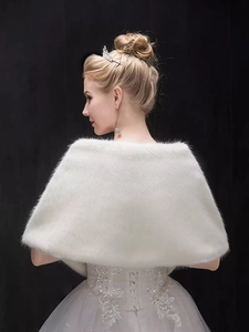 Rear view of white faux fur bridal shawl for weddings with crown and earrings