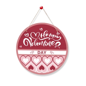 Detail of wooden Valentine's Day door sign with red heart pattern and rustic rope hanger