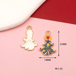 Macro detail of Christmas tree alloy pendants showing 21x14mm size and enamel finish