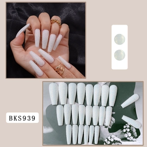 Detail of long ballerina press-on nails in sparkling white glitter finish, model BKS939