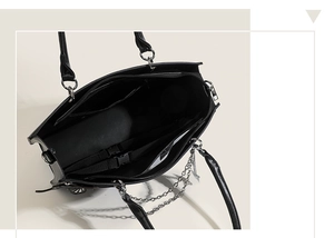 Internal view of gothic tote bag with zipper pockets and silver chain detail