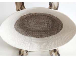 Top view of spacious woven beach bag showing interior structure and sturdy brown base