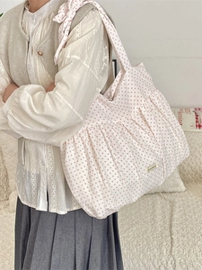 Chic light pink polka dot pleated canvas shoulder bag with soft cloud-like ruffles
