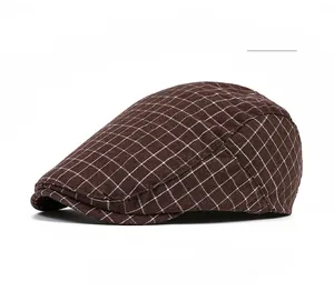Close-up of classic brown plaid flat cap with detailed check pattern and soft fabric