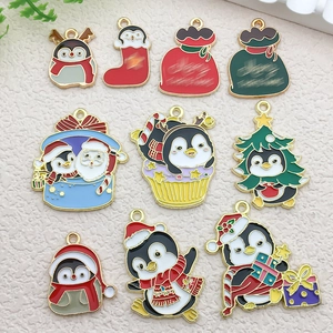 Detailed set of colorful Christmas penguin and Santa alloy charms for DIY jewelry making