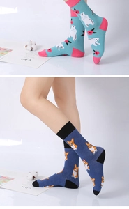 Close-up of cotton socks featuring cute polar bear and corgi dog cartoon patterns