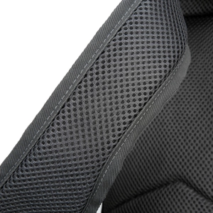 Close-up of breathable black honeycomb mesh fabric for comfort on travel waist bag