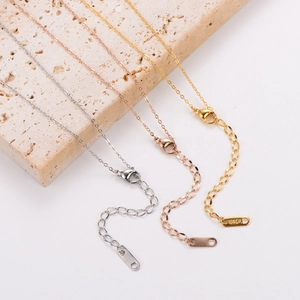 Detail of 18KGP lobster clasps and extension chains in gold, rose gold and silver colors
