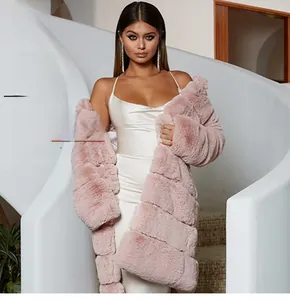 Detail of light pink faux fur coat featuring horizontal tiered texture and plush material