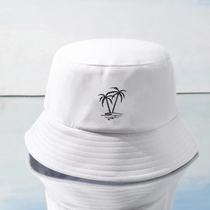 Unisex white cotton Y2K bucket hat featuring black coconut tree embroidery for sun protection