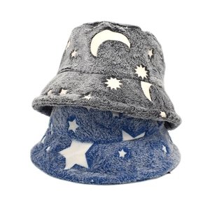 Detailed close-up of plush bucket hats with star and moon patterns in dark grey and royal blue