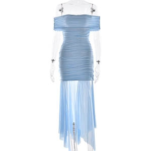 Detail of blue off-shoulder dress featuring pleated fabric and irregular tulle hemline