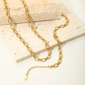 Detail of 18K gold plated stainless steel chain necklace with lobster clasp on stone