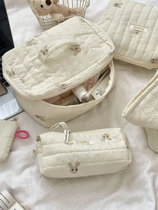 Quilted cotton cosmetic bag set featuring cute bunny embroidery in soft cream color