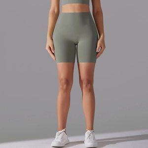 Close-up of sage green high-waisted seamless yoga shorts showing premium stretch fabric