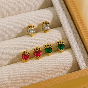 Macro detail of heart crown earrings in 14K gold with red green and white zircon