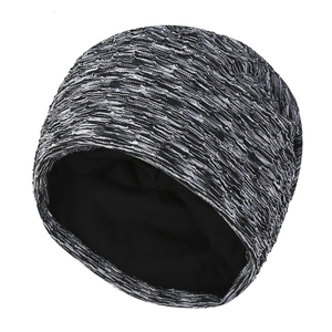Winter knitted beanie for women featuring a grey marl pattern and warm black fleece lining